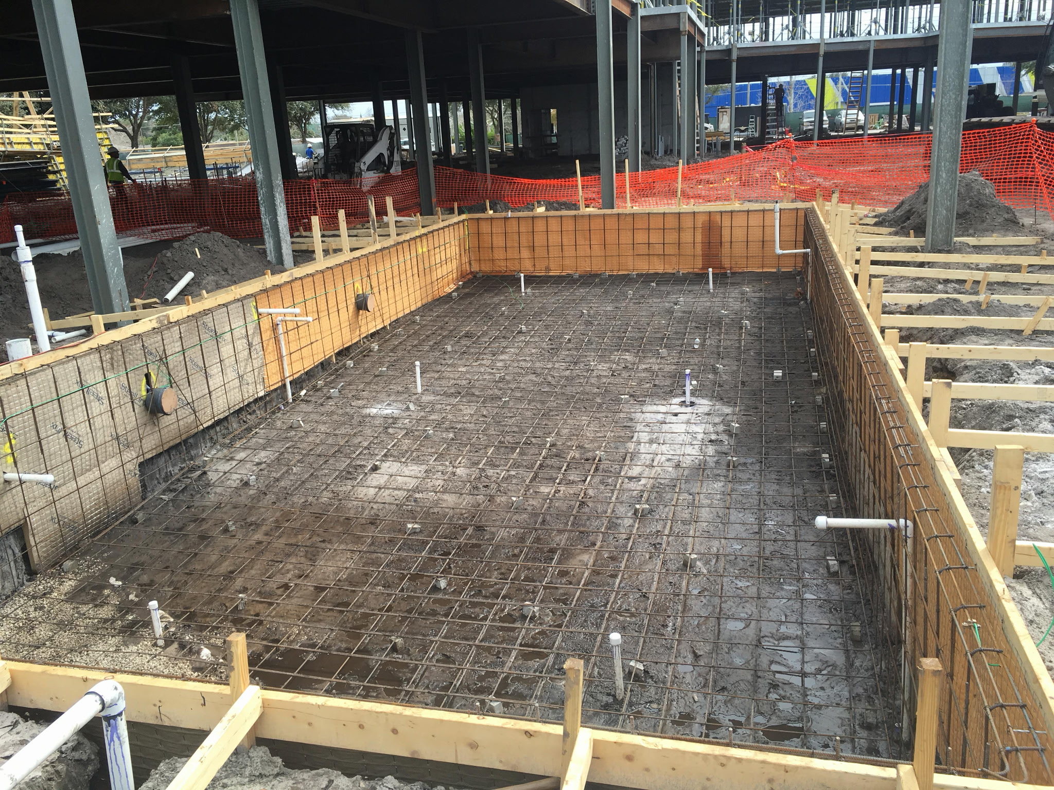 Rectangular rebar cage for a commercial pool under a multi-story structure