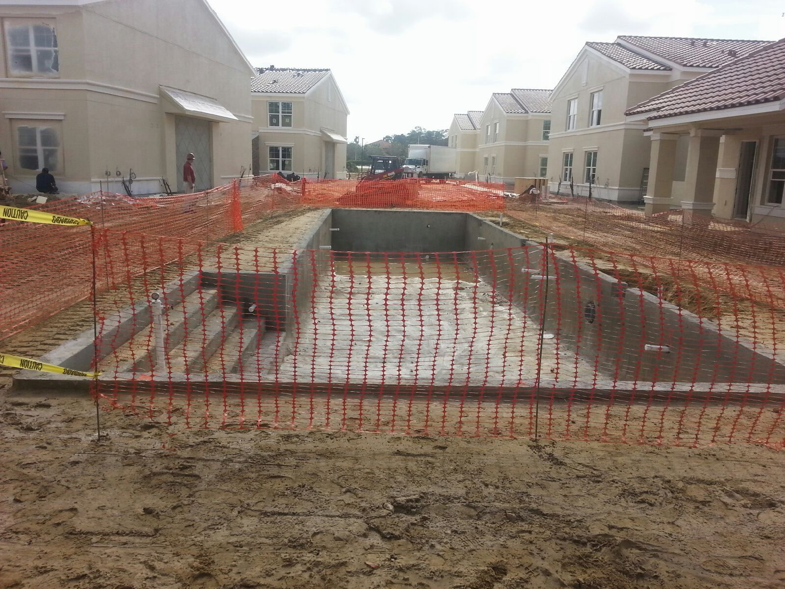 Concrete spa and pool shell at a townhome community amenity center